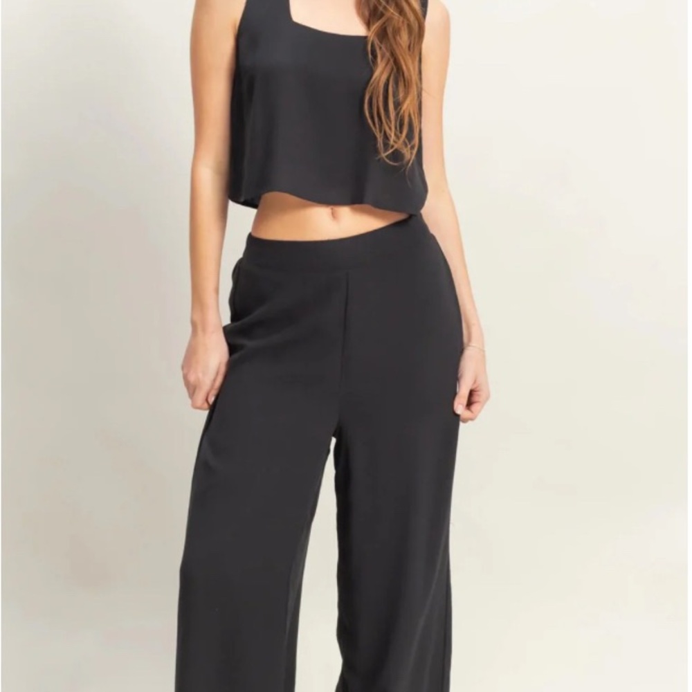 Elegant Black Women's Jumpsuit. Crop Top And Wide Cut Pants Set